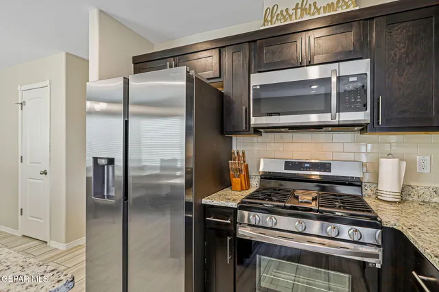 a kitchen with a stove and a microwave
