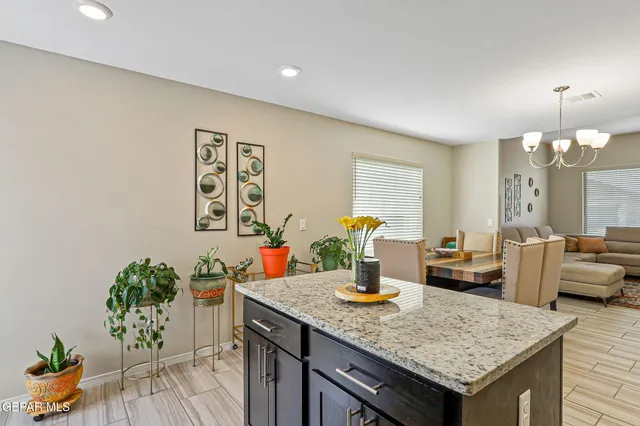 a kitchen with a table and chairs