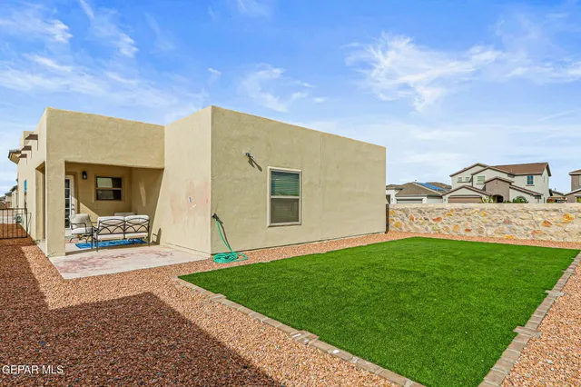 a view of a back yard of the house