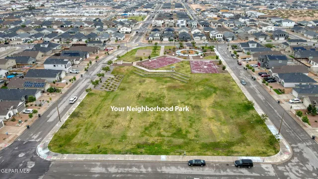 an aerial view of residential houses with outdoor space
