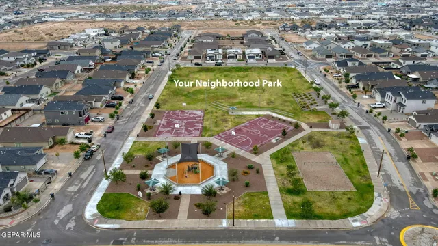 an aerial view of a swimming pool with outdoor space