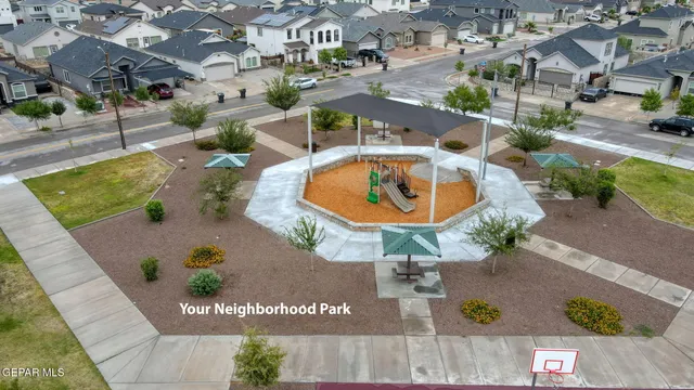 a view of a swimming pool with a yard