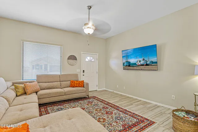 a living room with furniture and a rug