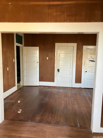 a view of a living room with wooden floor