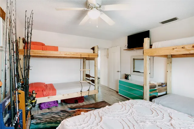 a bedroom with a bed and cabinets