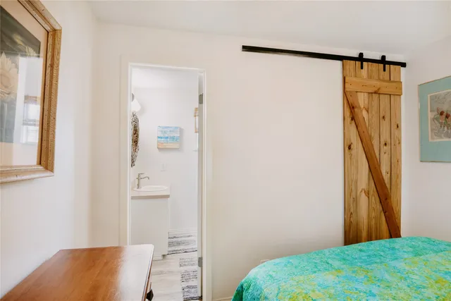 a bedroom with a bed and a cabinet