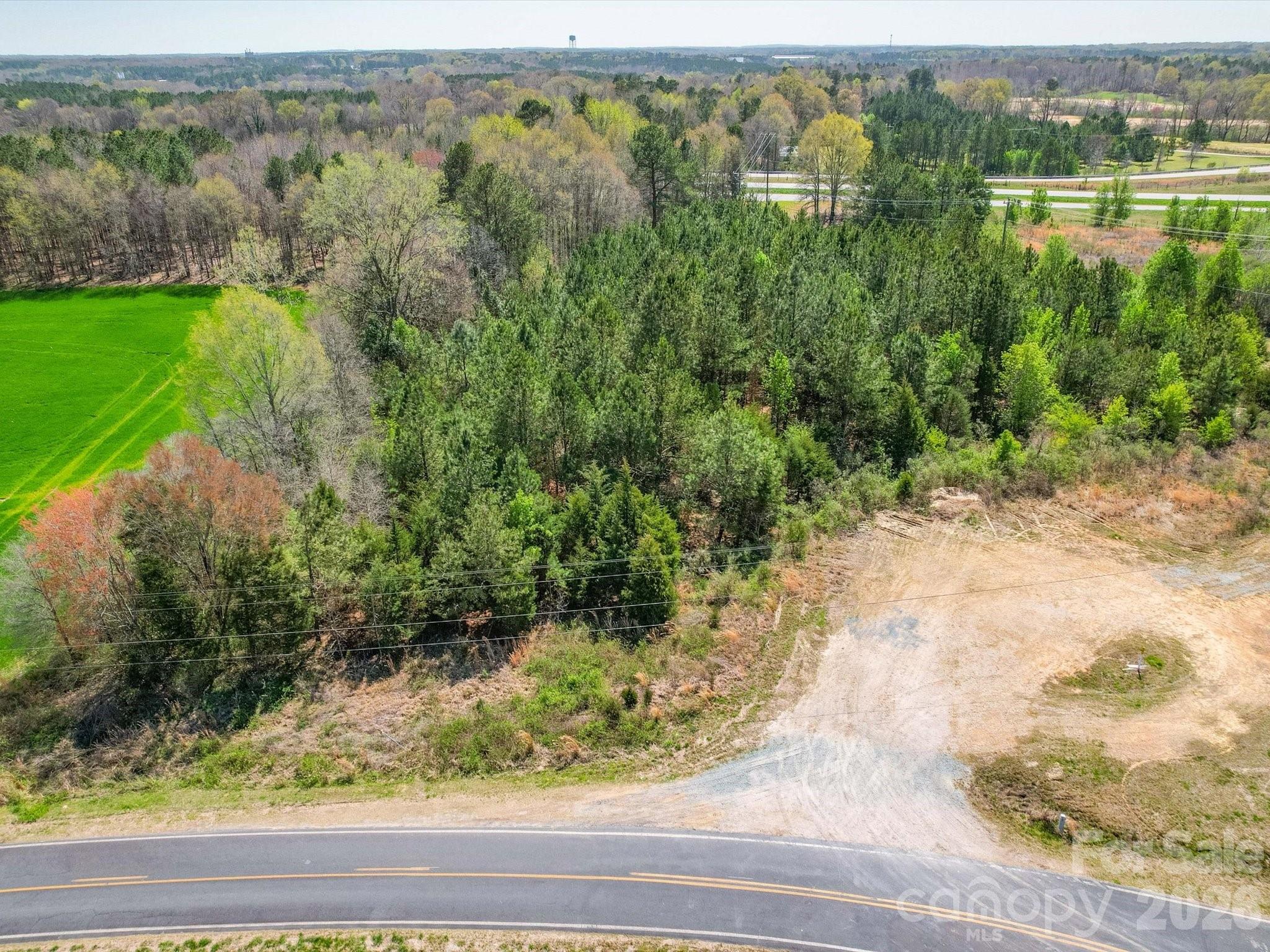 2722 Olive Branch Road Monroe, NC 28110 - Photo 5 of 7 a view of a lake view with houses in the background
