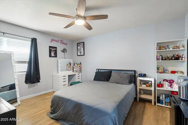 a bedroom with a bed and a dresser