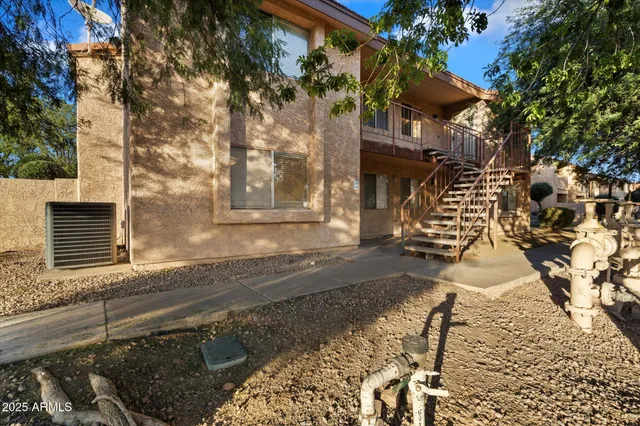 a view of a brick house with many windows