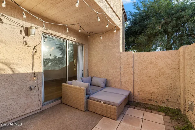 a view of a patio with glass door and glass windows