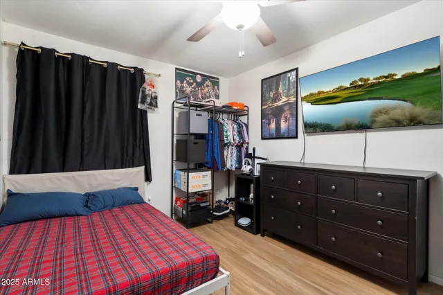 a bathroom with a sink vanity mirror and toilet