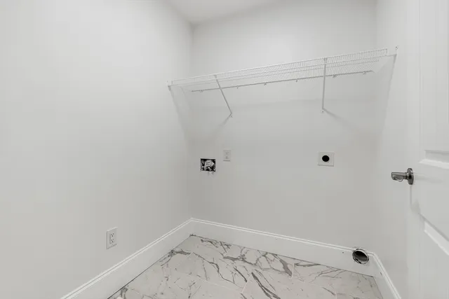 a bathroom with a toilet sink and a mirror