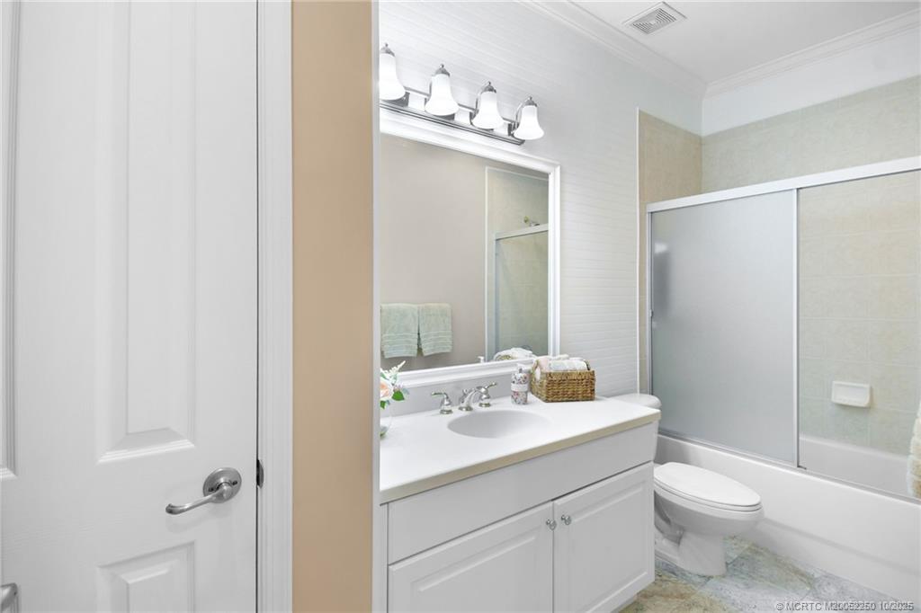 254 Southwest Walking Path Stuart, FL 34997 - Photo 21 of 31 a bathroom with a sink a toilet and shower