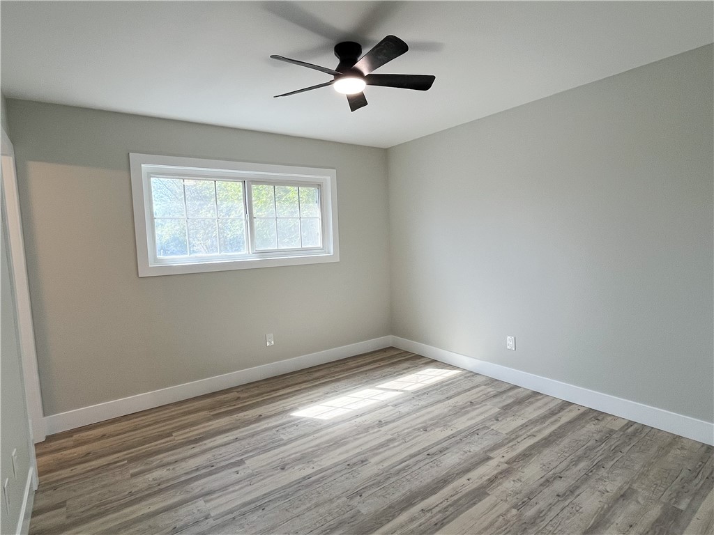 13004 Chestnut Avenue Rancho Cucamonga, CA 91739 - Photo 11 of 28 a view of empty room with wooden floor and fan