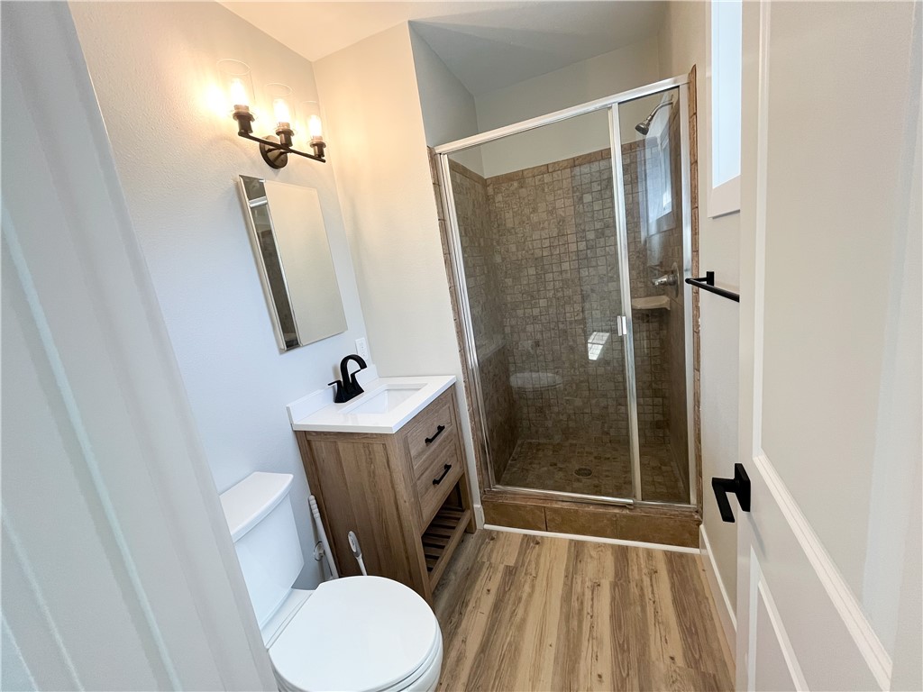 13004 Chestnut Avenue Rancho Cucamonga, CA 91739 - Photo 13 of 28 a bathroom with a toilet a sink and shower