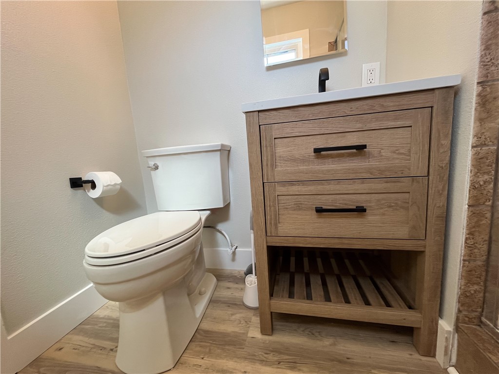 13004 Chestnut Avenue Rancho Cucamonga, CA 91739 - Photo 14 of 28 a bathroom with a toilet a sink and mirror
