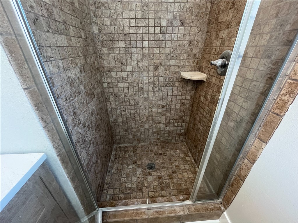 13004 Chestnut Avenue Rancho Cucamonga, CA 91739 - Photo 15 of 28 a bathroom with a shower