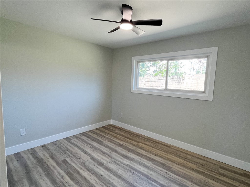 13004 Chestnut Avenue Rancho Cucamonga, CA 91739 - Photo 17 of 28 a view of empty room with wooden floor and fan