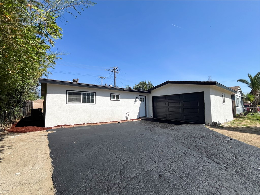 13004 Chestnut Avenue Rancho Cucamonga, CA 91739 - Photo 2 of 28 a view of a house with a yard