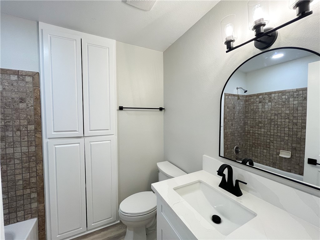 13004 Chestnut Avenue Rancho Cucamonga, CA 91739 - Photo 21 of 28 a bathroom with a sink a toilet and shower