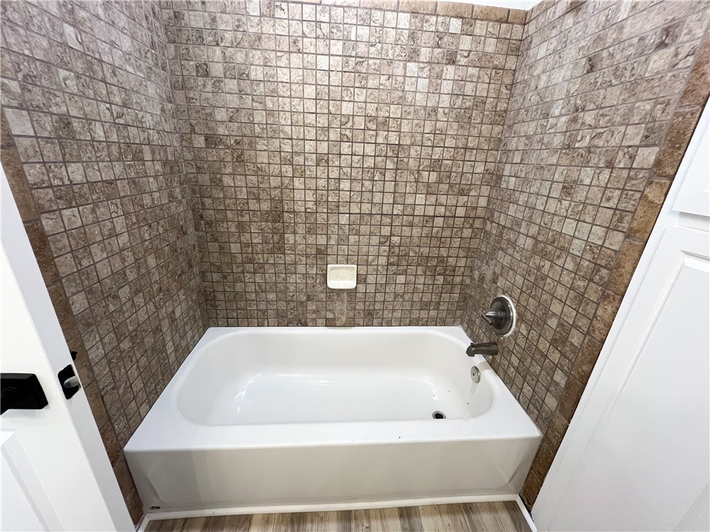 13004 Chestnut Avenue Rancho Cucamonga, CA 91739 - Photo 23 of 28 a bathroom with a bathtub