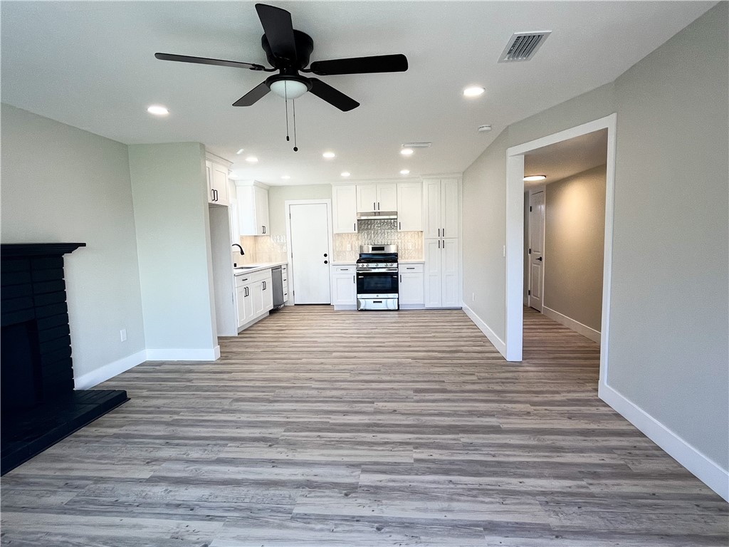 13004 Chestnut Avenue Rancho Cucamonga, CA 91739 - Photo 5 of 28 a view of a kitchen with a sink and a refrigerator