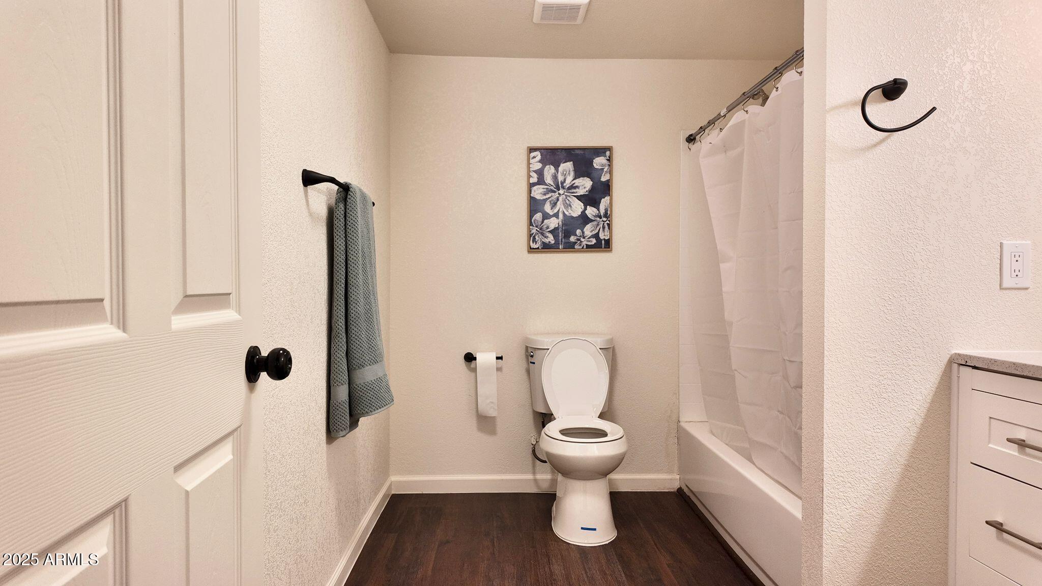 647 South Moonlight Drive Payson, AZ 85541 - Photo 11 of 50 a white toilet sitting next to a bathroom sink