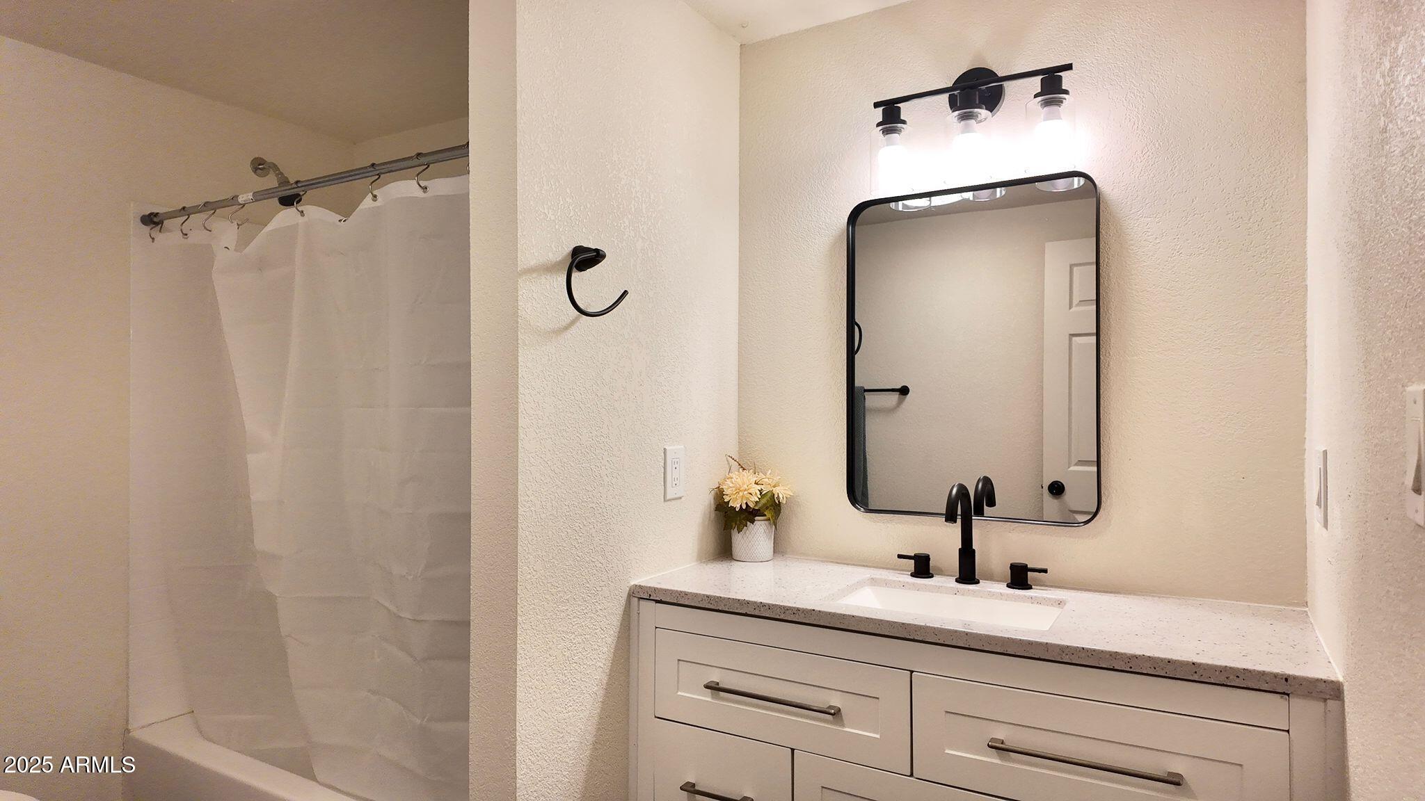 647 South Moonlight Drive Payson, AZ 85541 - Photo 12 of 50 a bathroom with a sink vanity granite and a mirror