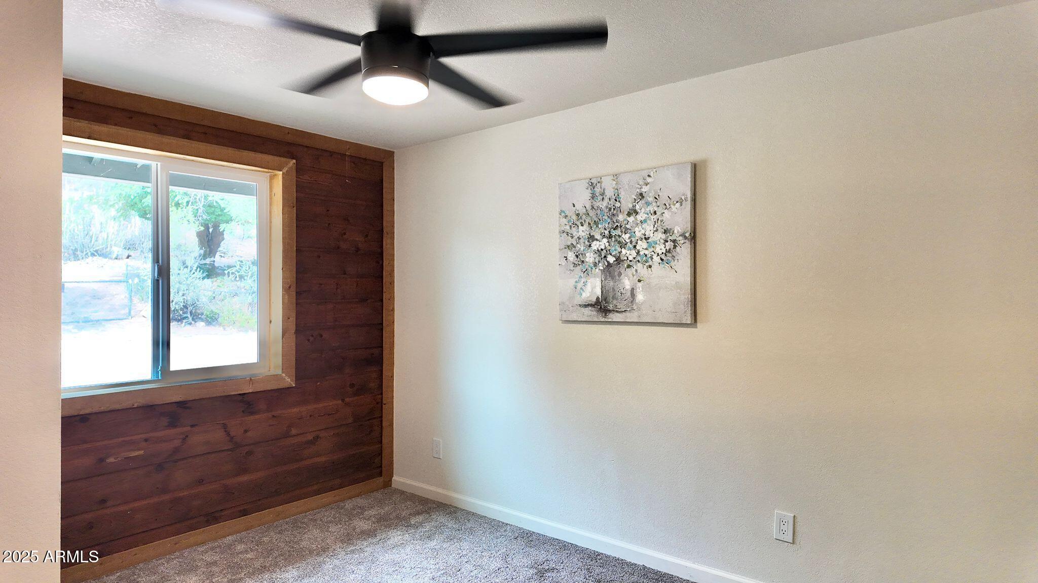 647 South Moonlight Drive Payson, AZ 85541 - Photo 14 of 50 wooden floor in an empty room with a window