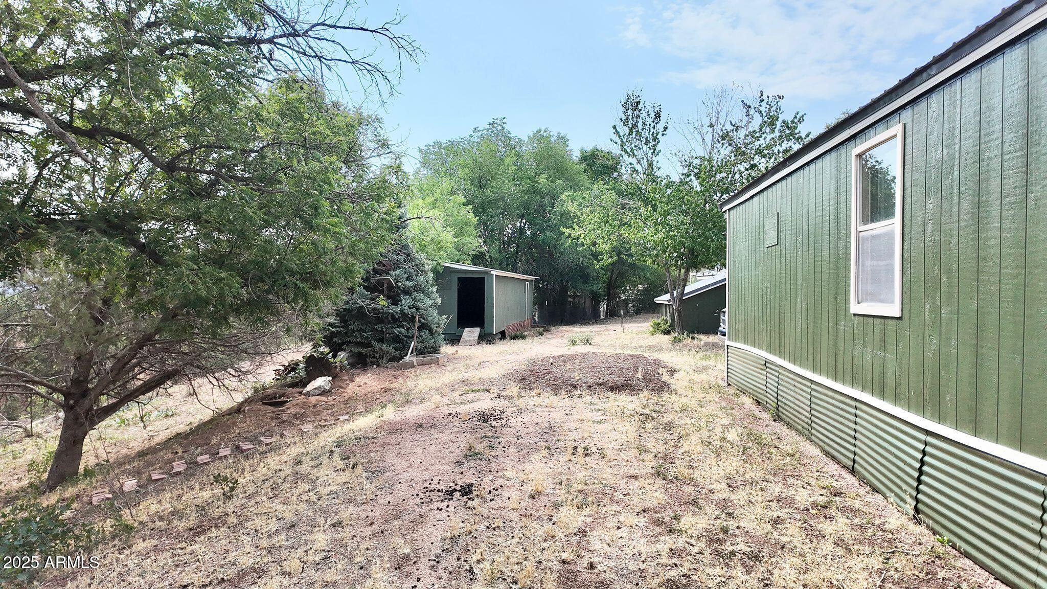 647 South Moonlight Drive Payson, AZ 85541 - Photo 25 of 50 a backyard of a house with seating space