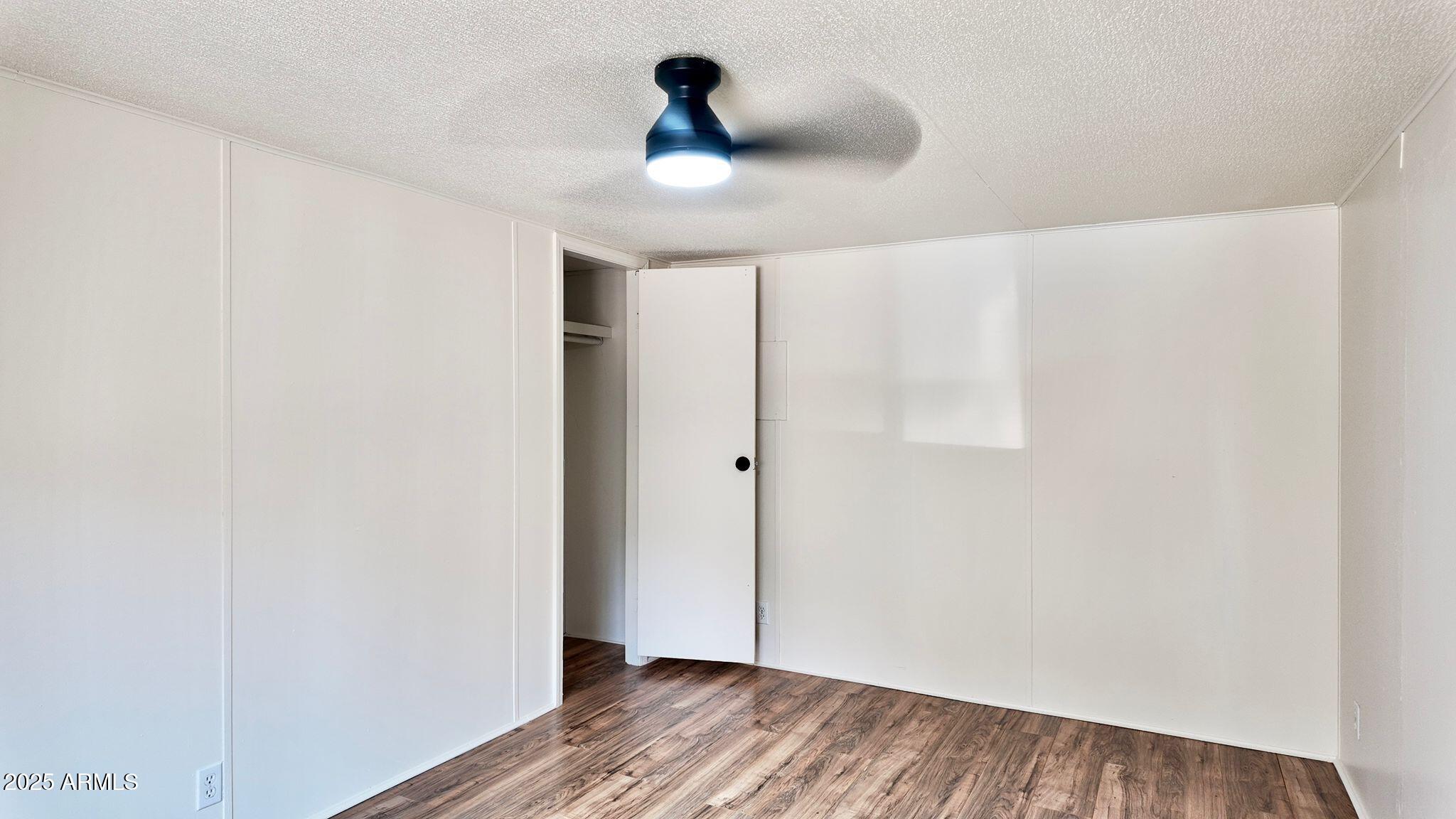 647 South Moonlight Drive Payson, AZ 85541 - Photo 28 of 50 a view of a ceiling fan and wooden floor