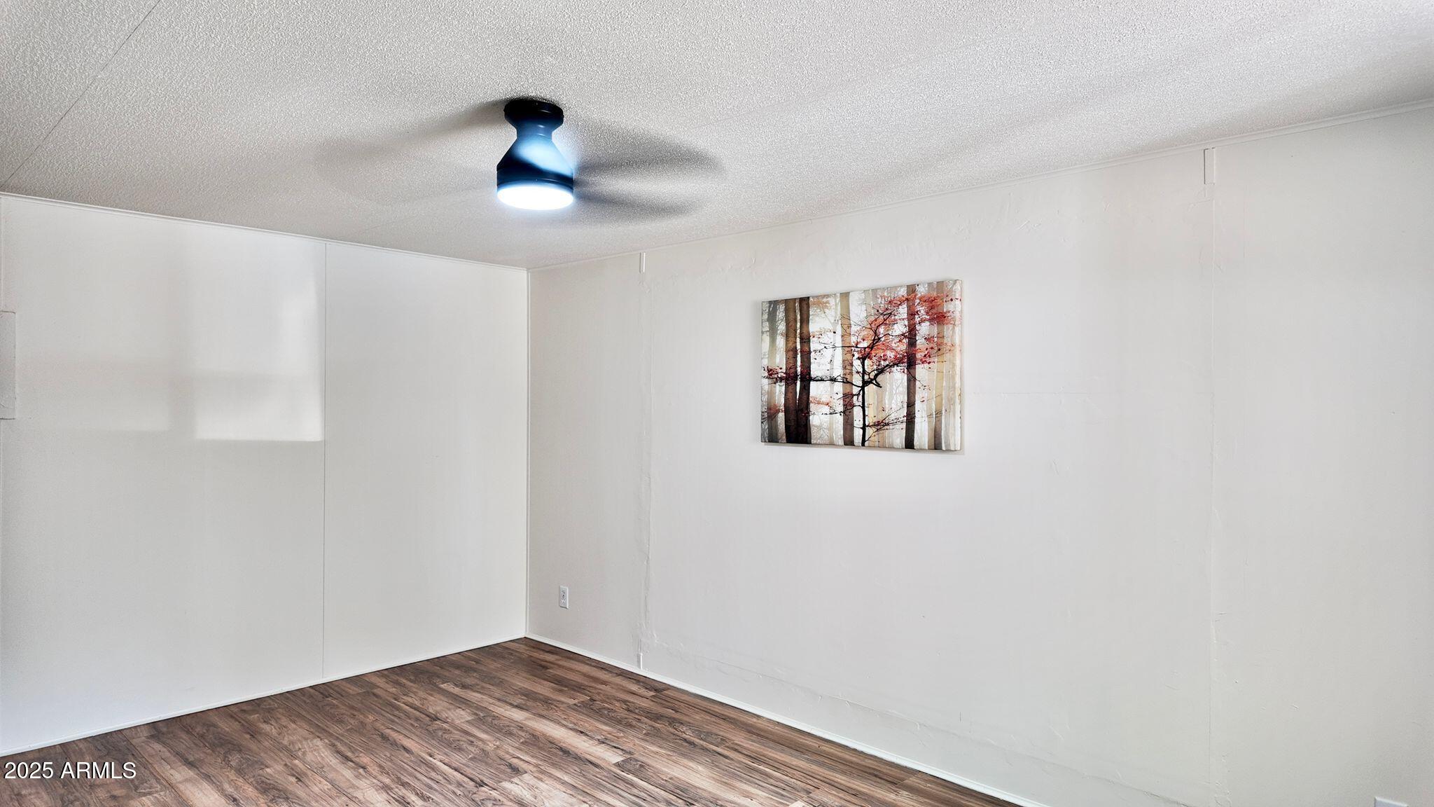 647 South Moonlight Drive Payson, AZ 85541 - Photo 29 of 50 a view of empty room with wooden floor