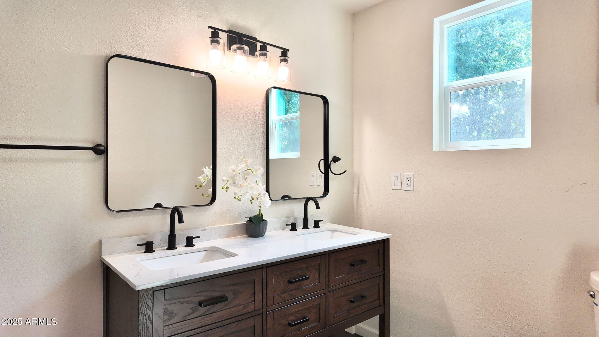 647 South Moonlight Drive Payson, AZ 85541 - Photo 3 of 50 a bathroom with a sink and a mirror