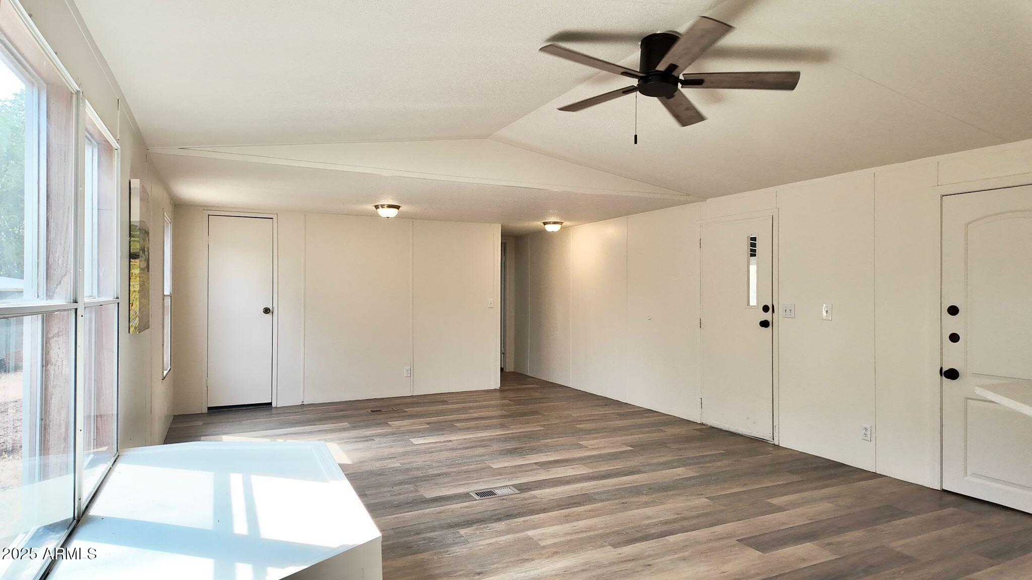 647 South Moonlight Drive Payson, AZ 85541 - Photo 32 of 50 a view of empty room with wooden floor and fan