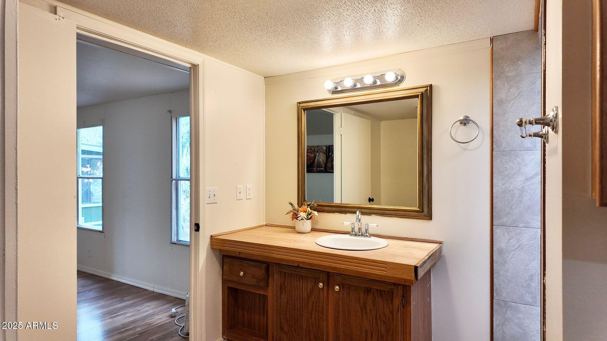 647 South Moonlight Drive Payson, AZ 85541 - Photo 34 of 50 a bathroom with a sink and a mirror