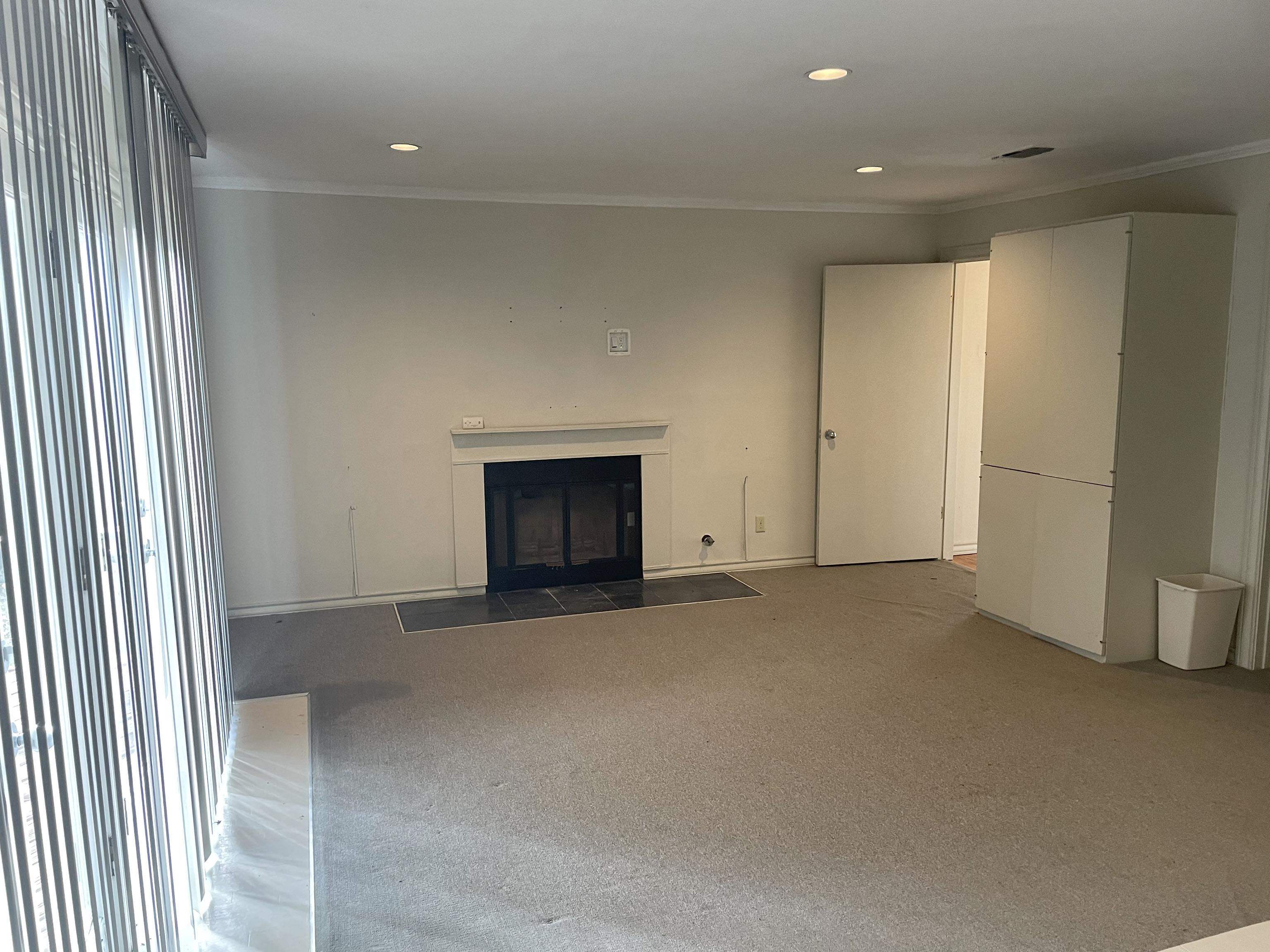 1801 West Commerce Street San Saba, TX 76877 - Photo 12 of 29 an empty room with a fireplace
