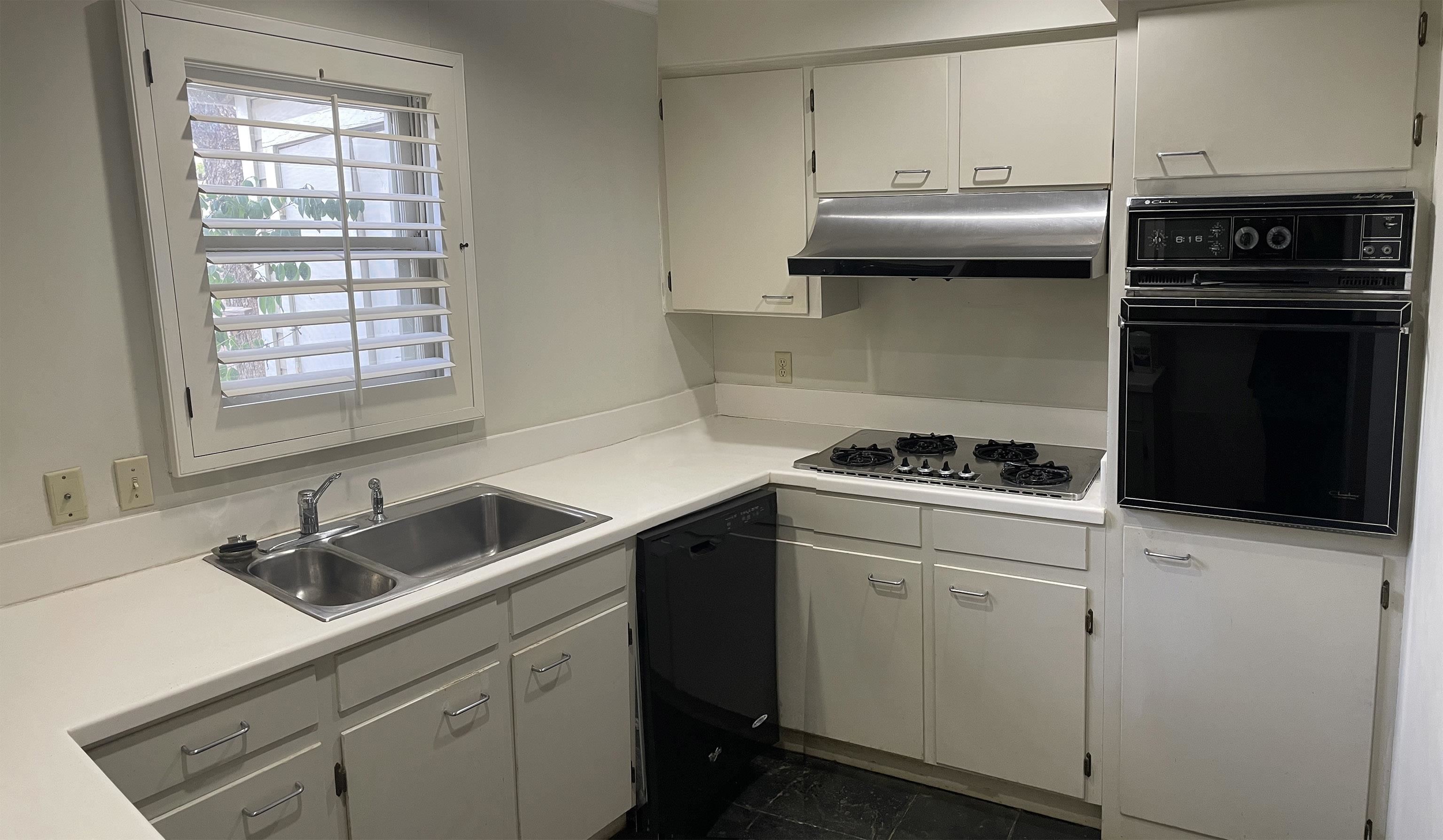 1801 West Commerce Street San Saba, TX 76877 - Photo 21 of 29 a kitchen with stainless steel appliances a sink stove and cabinets
