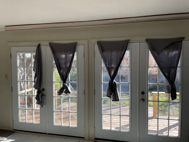 front view of a house with a large window