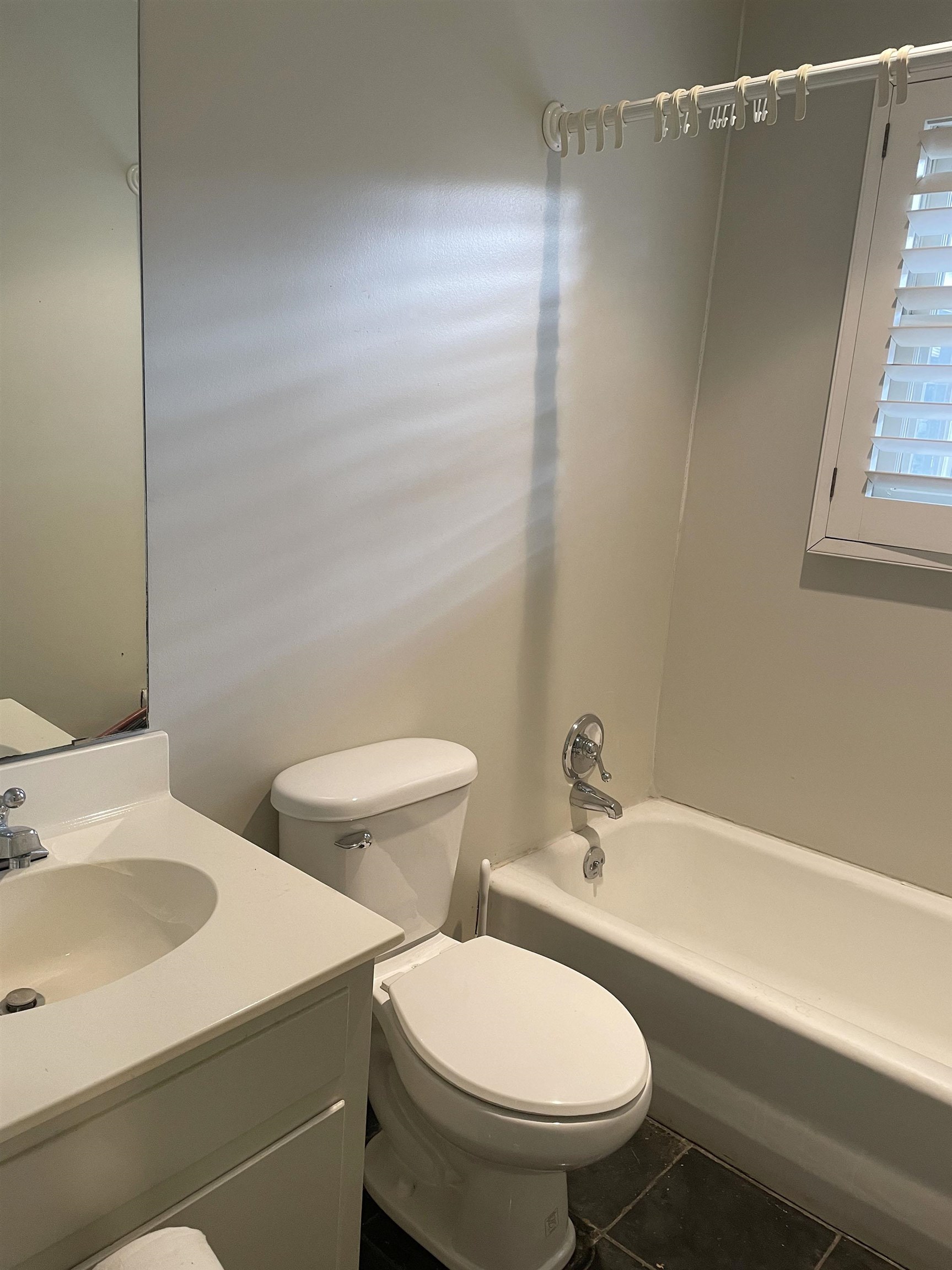 1801 West Commerce Street San Saba, TX 76877 - Photo 8 of 29 a white toilet sitting next to a bathroom sink