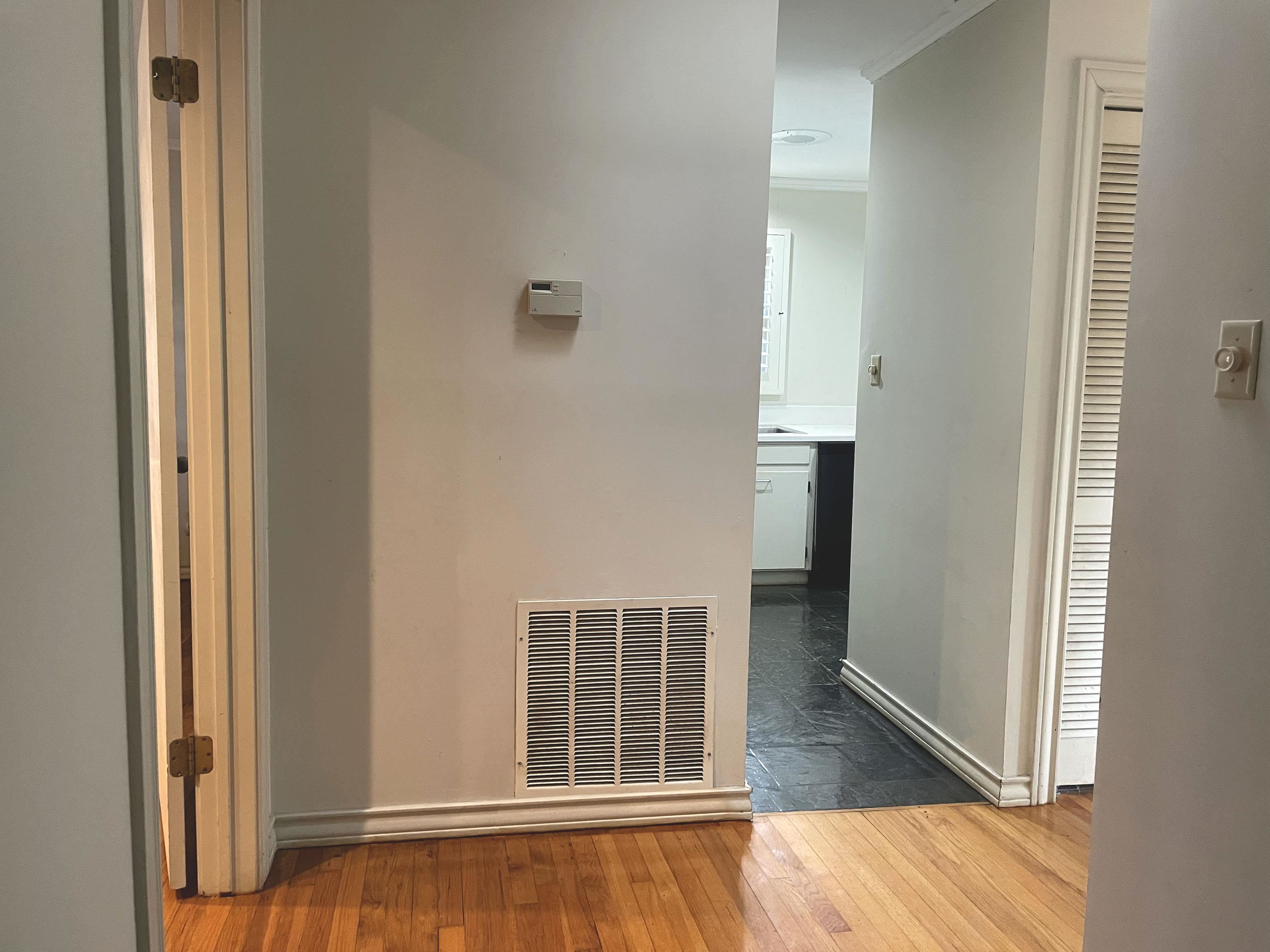 1801 West Commerce Street San Saba, TX 76877 - Photo 9 of 29 a view of an empty room with wooden floor and a window