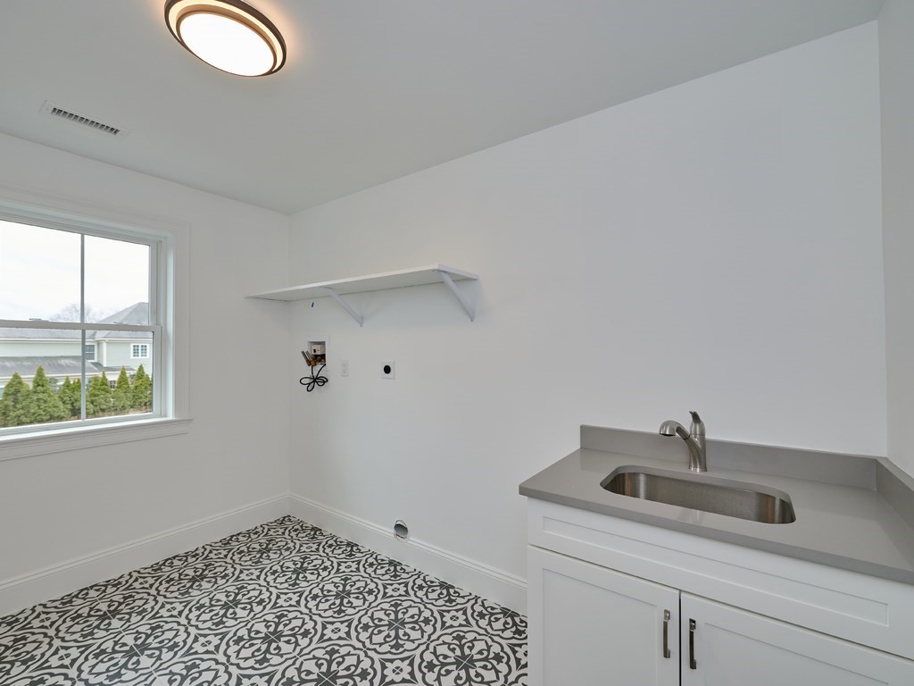 26 Old Colony Road Arlington, MA 02474 - Photo 18 of 32 a bathroom with a sink and a window