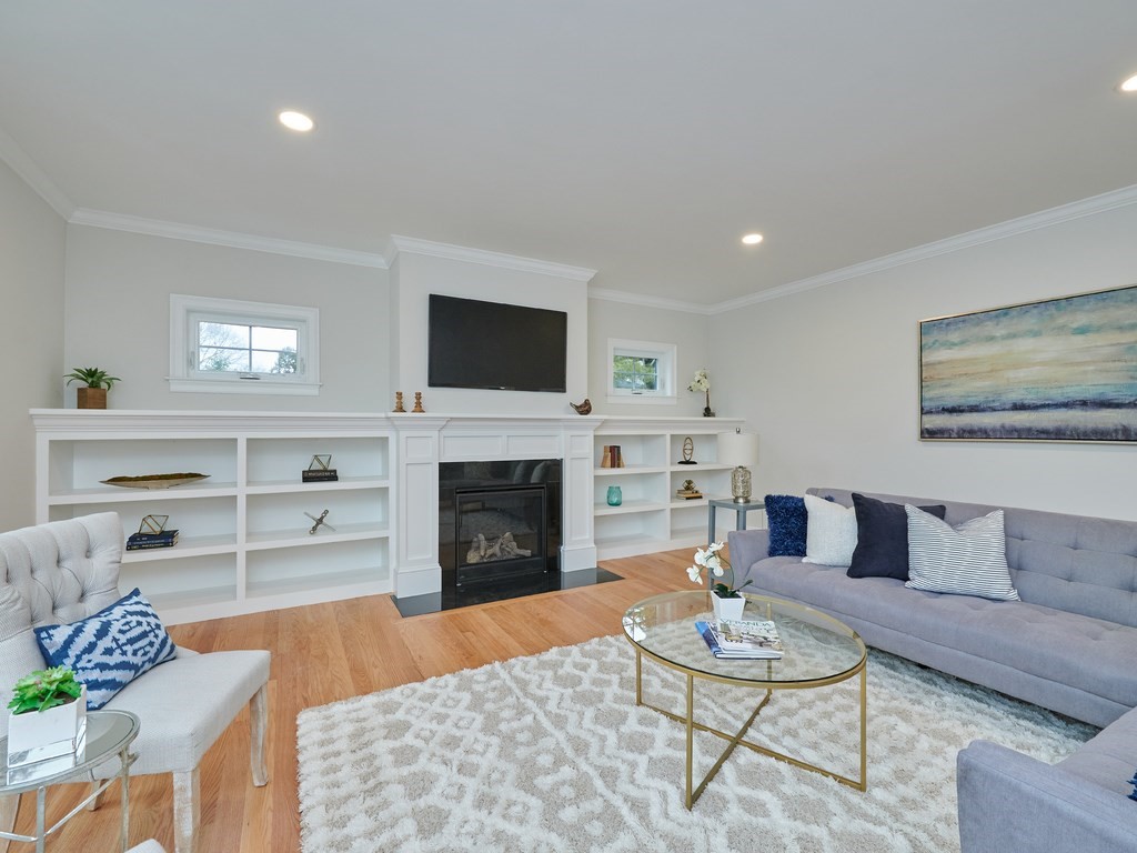 26 Old Colony Road Arlington, MA 02474 - Photo 6 of 32 a living room with furniture a fireplace and a flat screen tv
