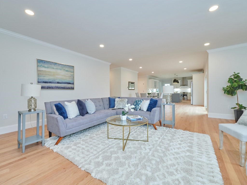 26 Old Colony Road Arlington, MA 02474 - Photo 7 of 32 a living room with furniture and a dining table with wooden floor