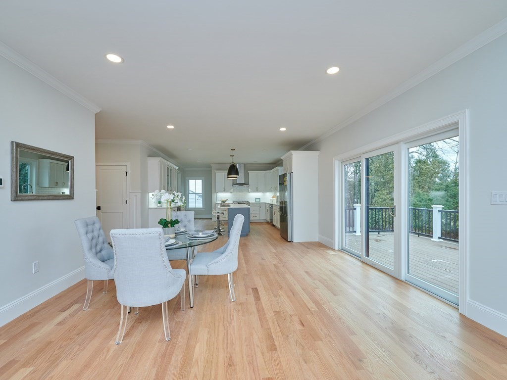 26 Old Colony Road Arlington, MA 02474 - Photo 8 of 32 a view of a dining room with furniture window and wooden floor