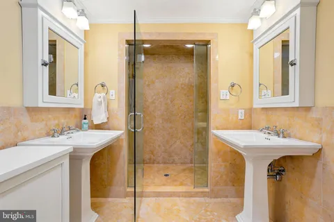 an entryway with wooden floor and cabinet