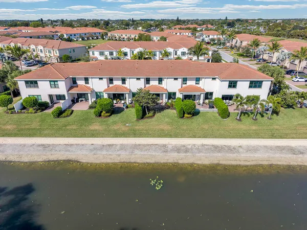 an aerial view of residential houses with lake view and mountain view