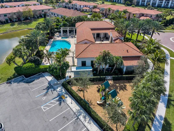 an aerial view of house with swimming pool