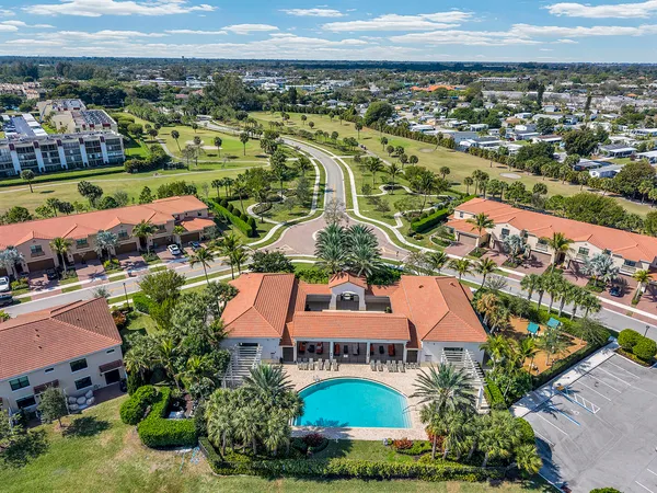 an aerial view of residential houses and outdoor space