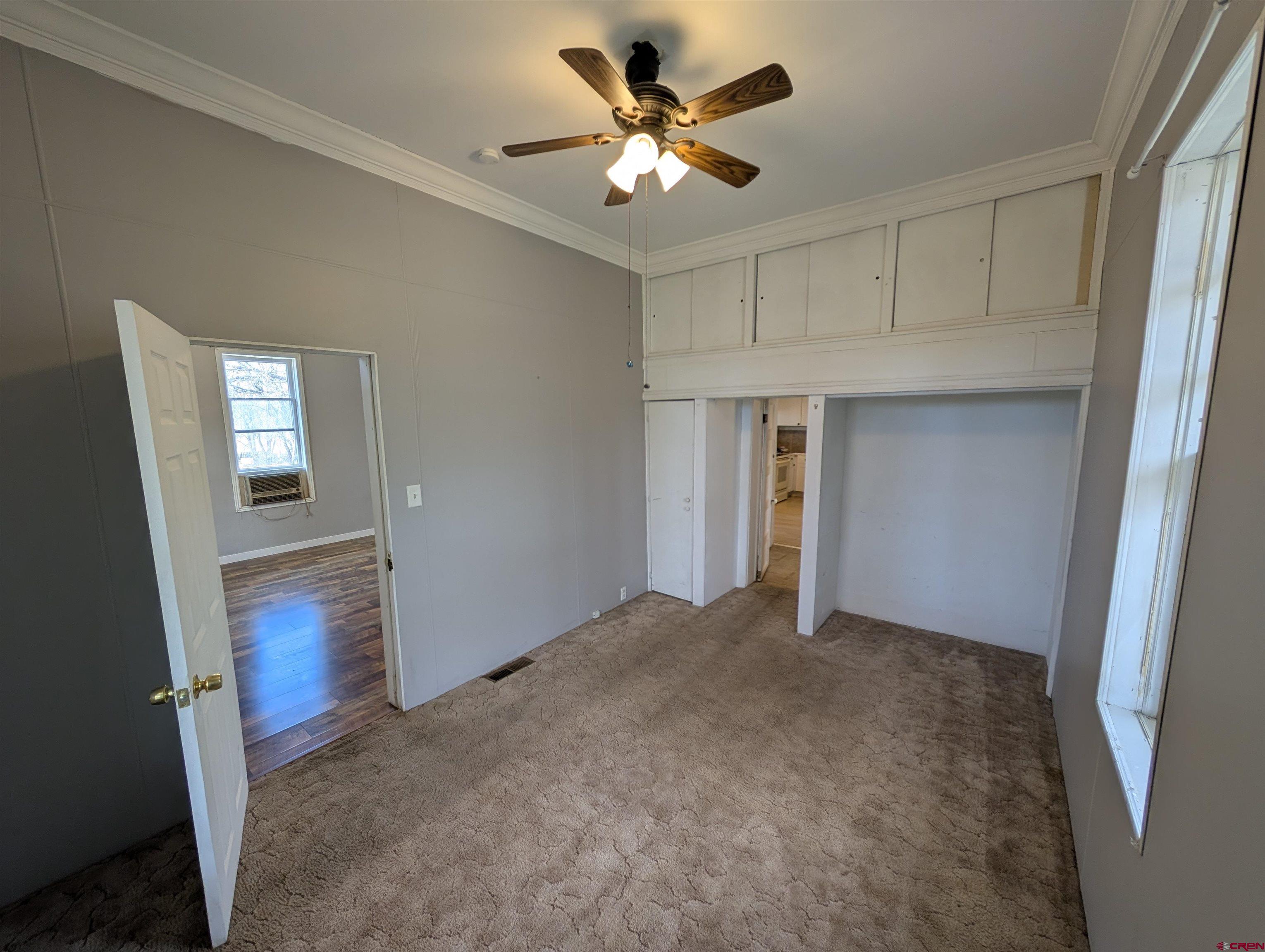 16184 Chipeta Road Montrose, CO 81403 - Photo 11 of 24 a view of a livingroom with a ceiling fan and window