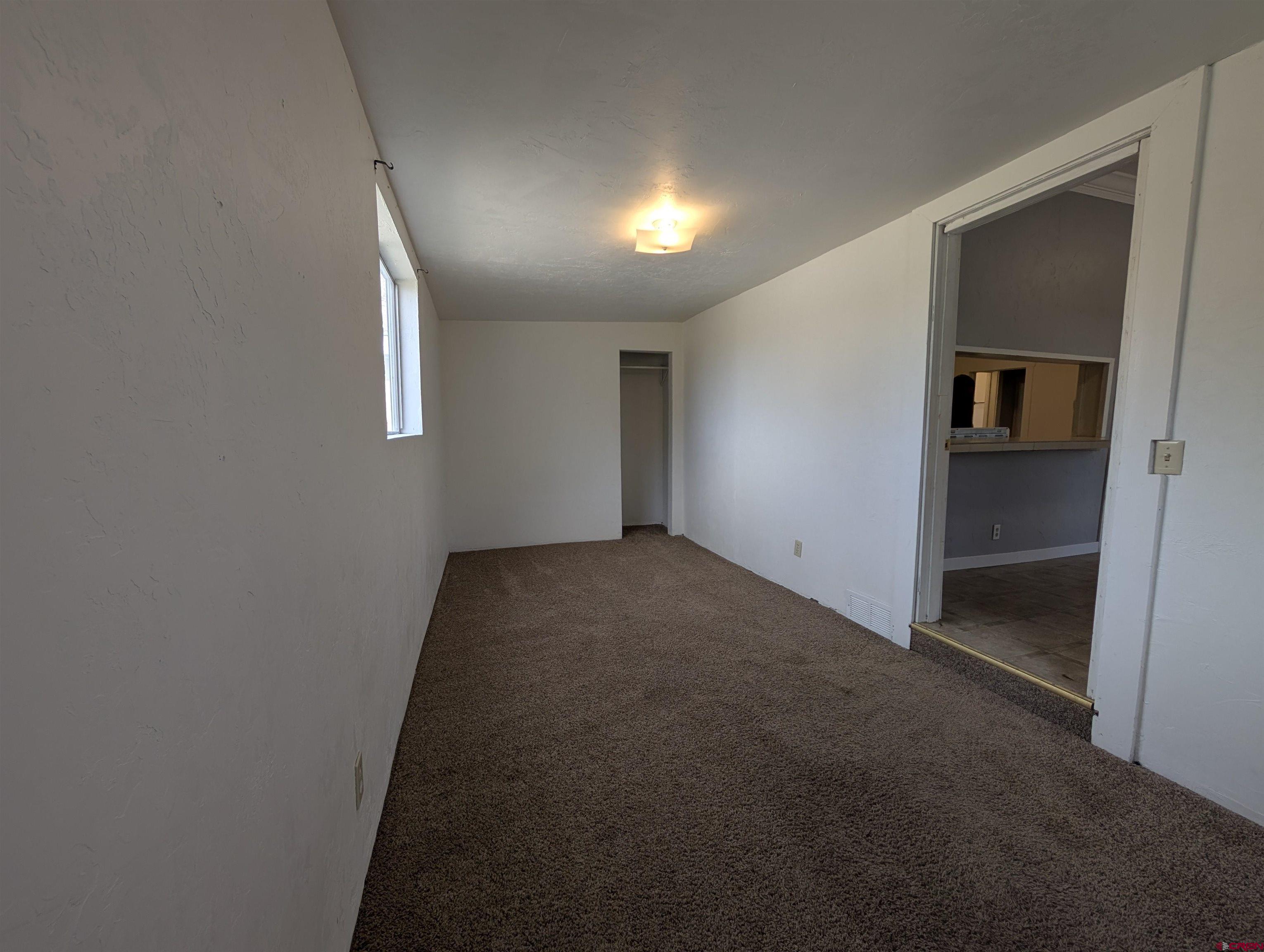 16184 Chipeta Road Montrose, CO 81403 - Photo 14 of 24 an empty room with windows